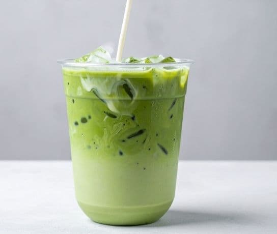 Iced matcha latte in a tall glass